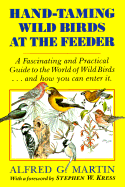 Hand-taming wild birds at the feeder.