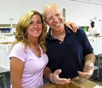 Mariah DeLeon and Alibris employee Steve Pollack volunteer at a local food bank.