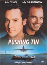 Pushing Tin
